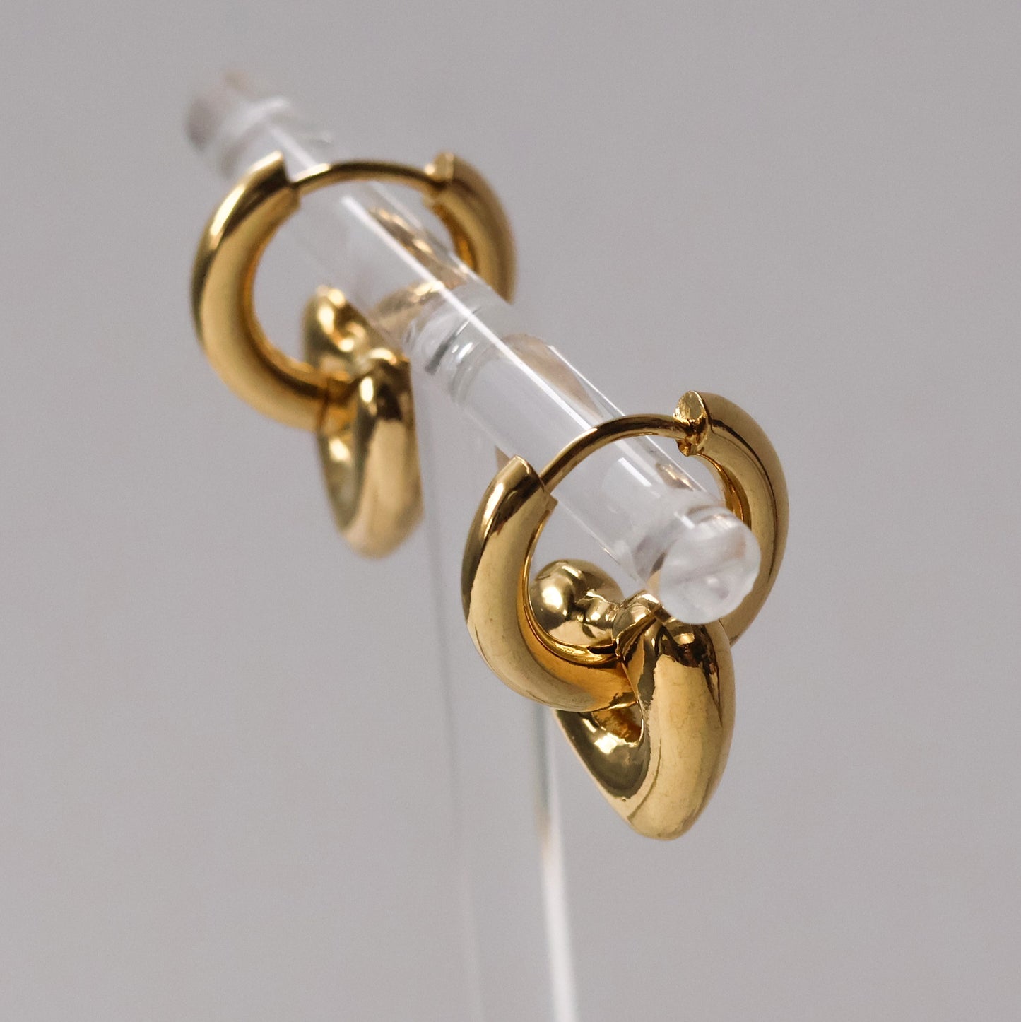 Carys gold plated heart huggie hoop earrings