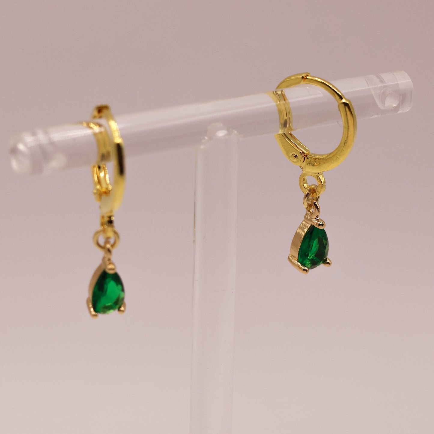 Sadie gold plated huggies earrings with emerald zircon