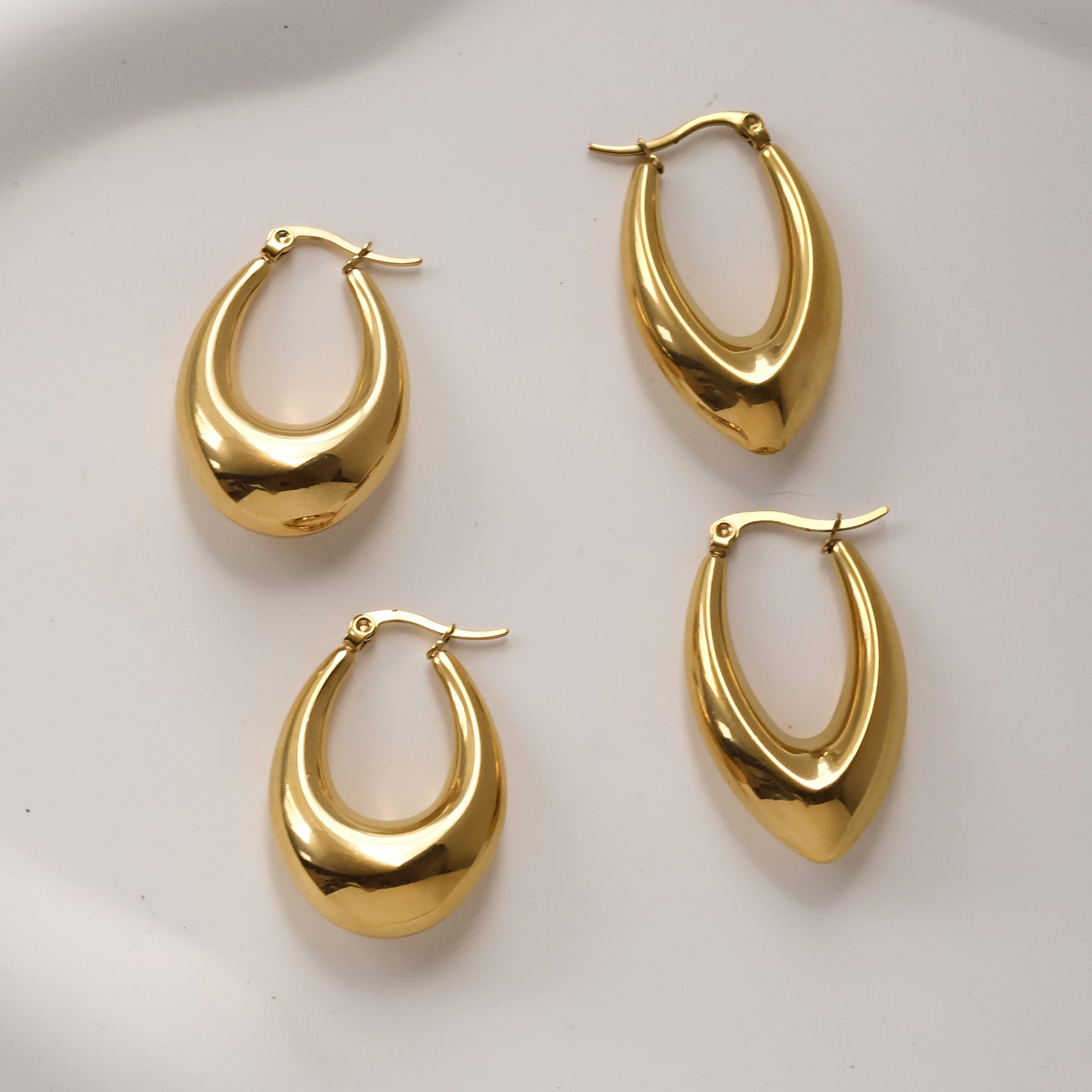 Statement gold plated huggies earrings