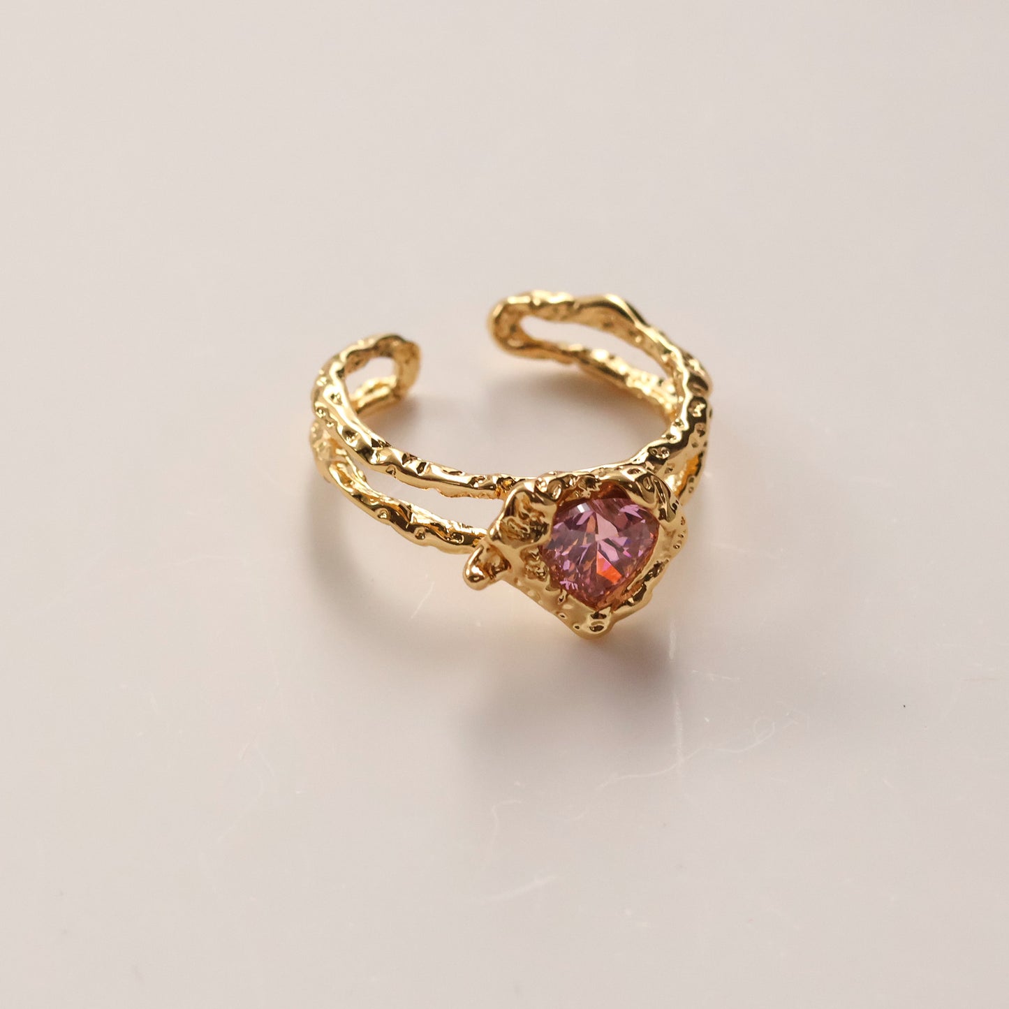 Gold plated open heart ring with pink cubic zirconia