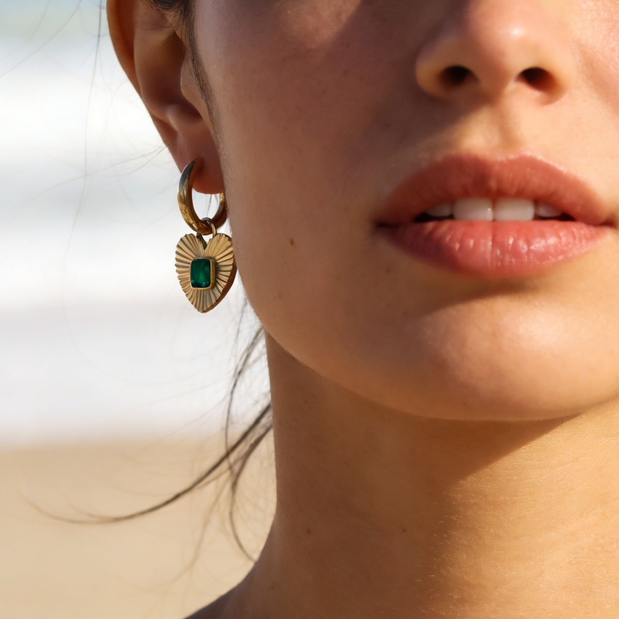 Alice gold plated huggies earring with emerald zircon