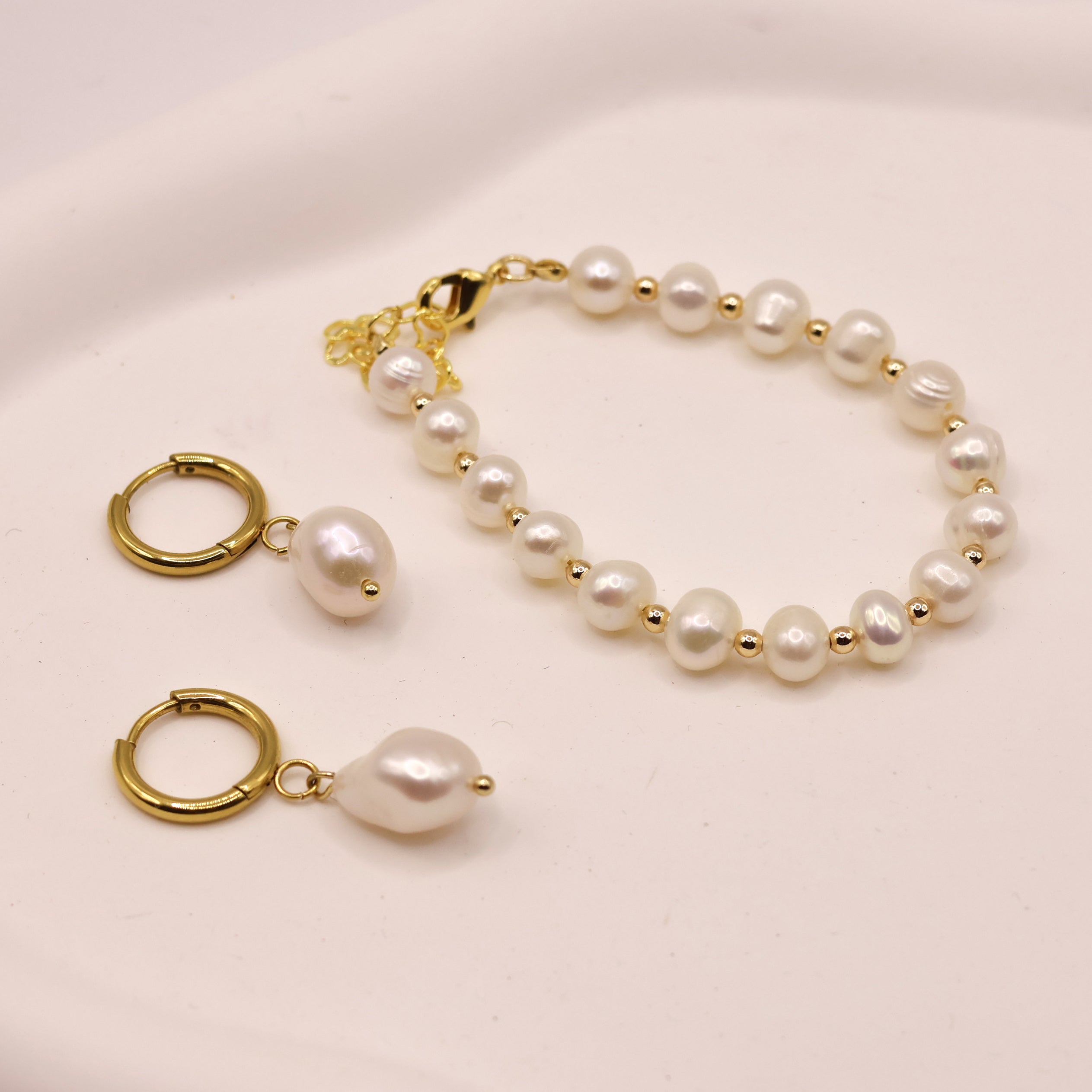 Ava pearl huggies gold plated