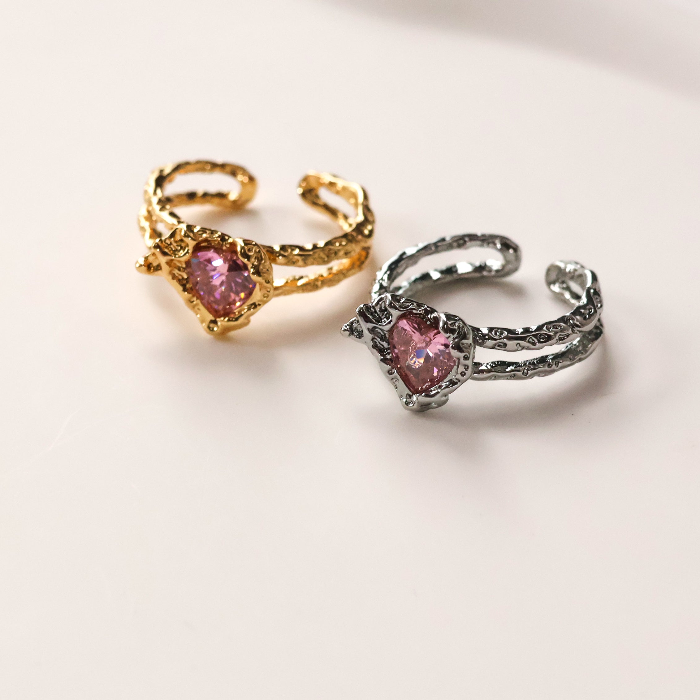 Gold plated open heart ring with pink cubic zirconia